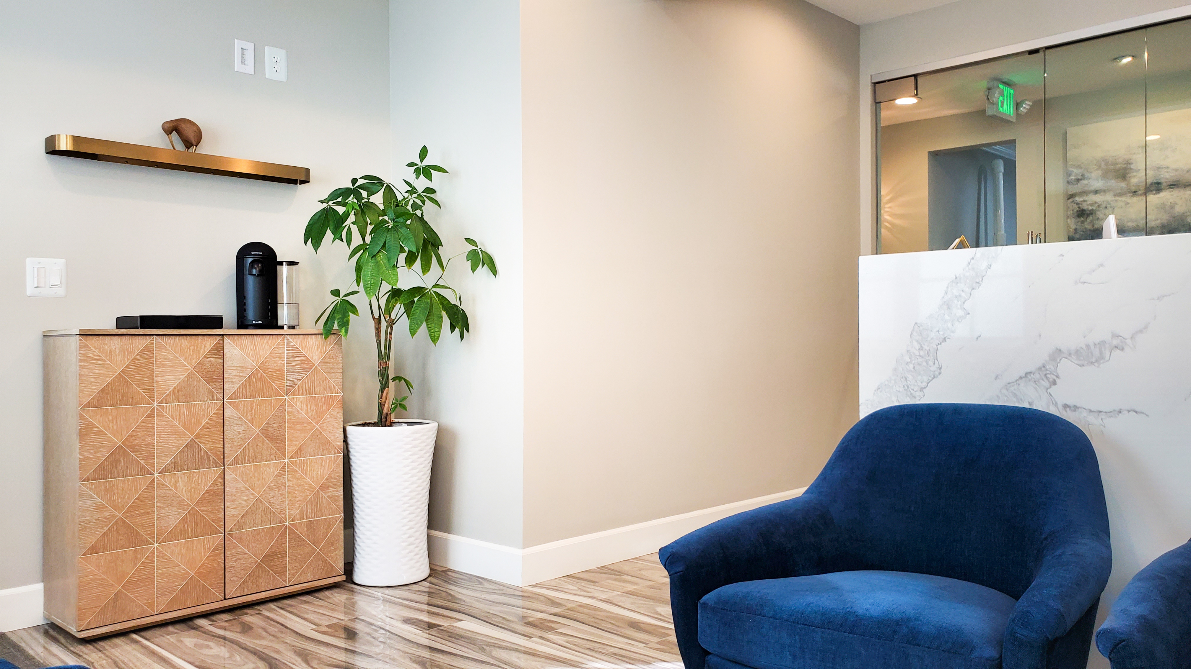 Sunny Hills Dentistry cozy waiting area corner with plant and comfortable seating